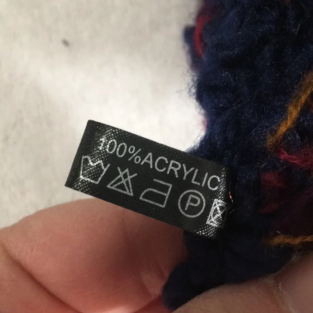 Blue knitted look infinity scarf with touches of red green gold